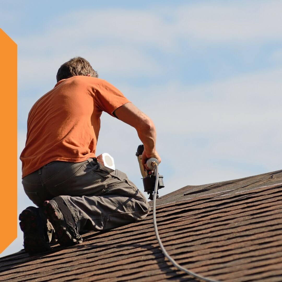 Contractor conducting a roof repair