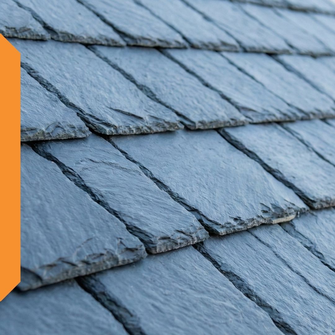 Close-up of blue-gray natural slate roof tiles laid in overlapping rows